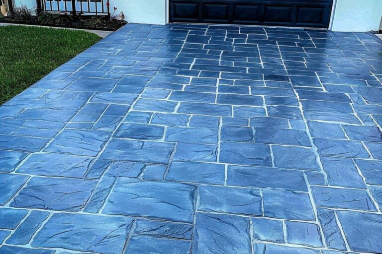 a driveway stamped to look like it was made from blue slate pavers