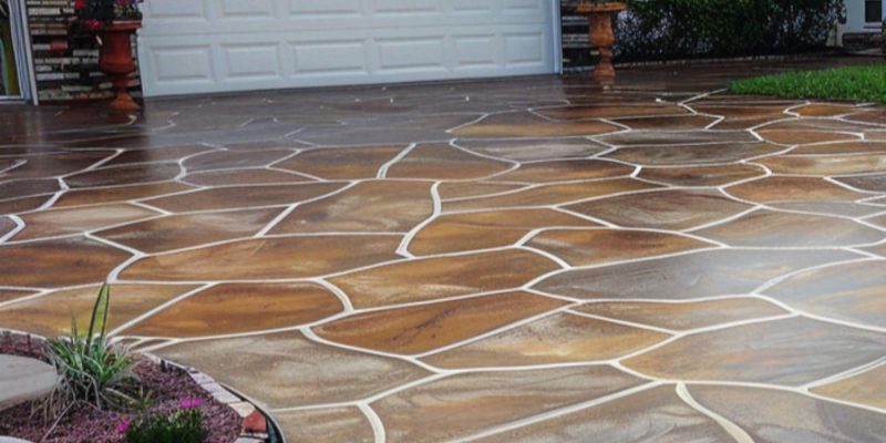 A stamped concrete, stained and painted driveway